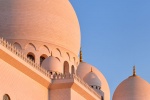 A view of the domes of Sheikh Zayed Grand Mosque at sunset, Abu Dhabi, United Arab Emirates