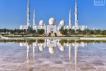 A color fine art photo of Sheikh Zayed Grand Mosque reflected in the pool at Wahat al Karama, Abu Dhabi, UAE