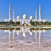 A color fine art photo of Sheikh Zayed Grand Mosque reflected in the pool at Wahat al Karama, Abu Dhabi, UAE