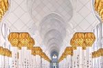 A view of the ornate colonnade and arches at the Sheikh Zayed Grand Mosque in Abu Dhabi, United Arab Emirates