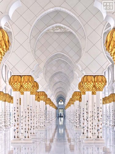A view of the ornate colonnade and arches at the Sheikh Zayed Grand Mosque in Abu Dhabi, United Arab Emirates