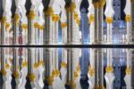 A view of the colonnade at Sheikh Zayed Grand Mosque at night, reflected in a pool. Abu Dhabi, United Arab Emirates. Limited edition fine art prints of this photo are available framed in various wood, metal, and acrylic styles. 