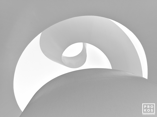 Black and white fine art photography of a contemporary architectural detail spiraling to the open sky. Large-scale fine art prints of this photo are available up to 72 inches and framed in wood, metal, and acrylic styles.