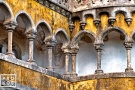 A fine art architectural photo of a neo-gothic colonnade from the Palacio da Pena in Sintra, Portugal