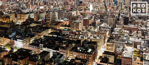 An ultra-high-definition panoramic photo of the rooftops of SoHo, New York City transitioning from day to night, from Andrew's 'Night & Day' series.