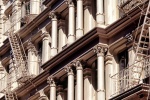 An architectural photo of the ornate cast iron facade of a Soho loft building, New York City
