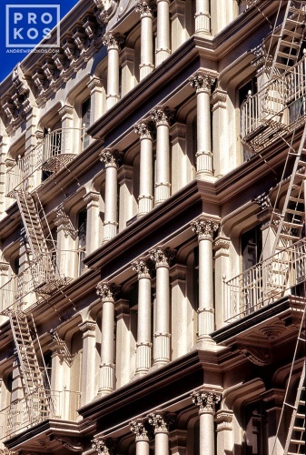 An architectural photo of the ornate cast iron facade of a Soho loft building, New York City