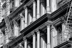 A black and white architectural photo of the ornate cast iron facade of a Soho loft building, New York City. Framed fine art prints of this photo are available in various sizes, please inquire. 