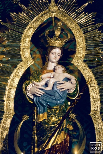 A gilded polychrome Madonna and child (Virgin Mary) statue found in a church in Madrid, Spain. Fine art prints of this photo are available framed in various styles, please inquire. 