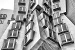 A black and white architectural photo of the Stata Center at the Massachusetts Institute of Technology by photographer Andrew Prokos