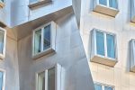 A color architectural photograph of the linear titanium-sheathed facade and windows of the Stata Center at the Massachusetts Institute of Technology by architect Frank Gehry. Limited edition fine art prints of this photo are available up to 72 inches in height and framed in various wood, metal and acrylic styles.