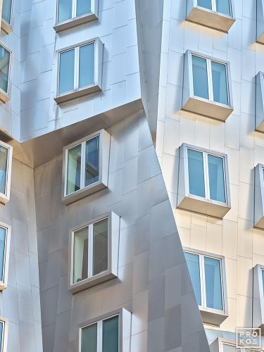 A color architectural photograph of the linear titanium-sheathed facade and windows of the Stata Center at the Massachusetts Institute of Technology by architect Frank Gehry. Limited edition fine art prints of this photo are available up to 72 inches in height and framed in various wood, metal and acrylic styles.