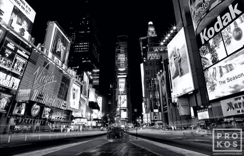 A wide angle view of Times Square at night in black and white, New York City