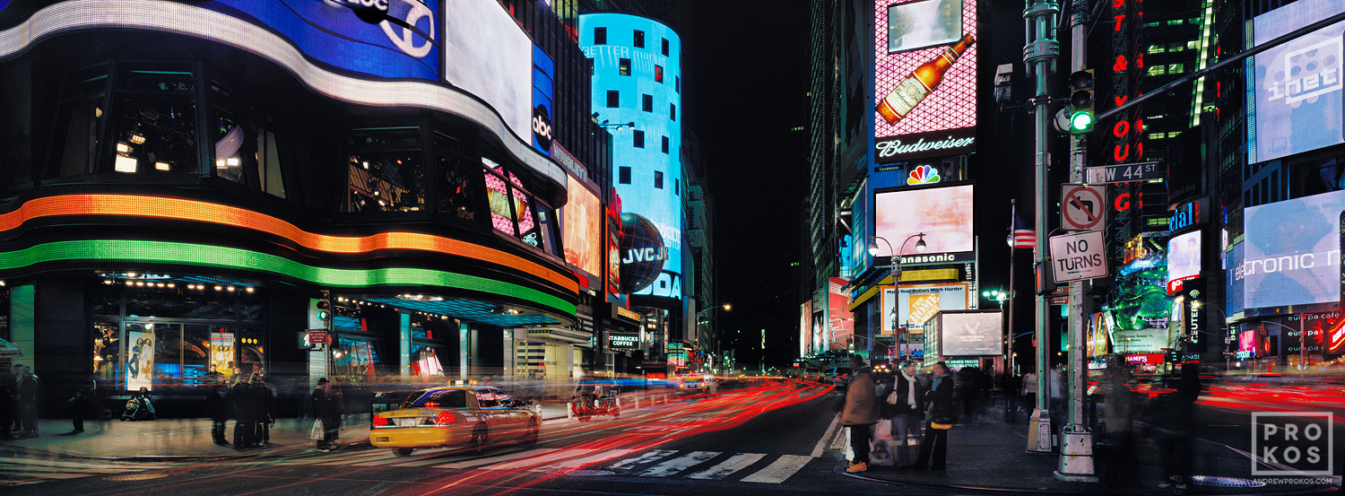 An ultra high-definition panoramic photo of the signs of New York City's Times Square at night taken with a long exposure. Large-scale fine art prints of this photo are available up to 120 inches wide.