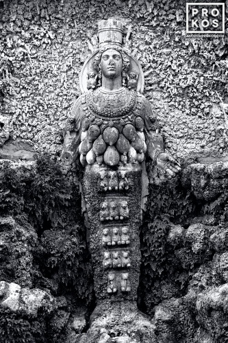 A black and white fine art photo of the statue of the Ephesian Diana in the Villa D'Este Gardens, Tivoli, Italy