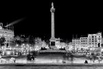 Night photography of Trafalgar Square and Nelson's Column in black and white, London, United Kingdom. High-definition limited edition prints of this photo are available up to 120 inches in width.