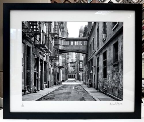 A matted and framed black and white photograph of a Tribeca street scene by photographer Andrew Prokos