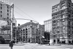 A black and white street scene photo from West Broadway in Tribeca, New York City. Fine art prints of this photo are available framed in various styles. 