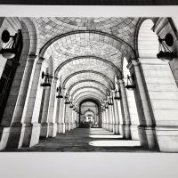 A matted black and white architectural fine art print of 'Union Station Arcade' by photographer Andrew Prokos