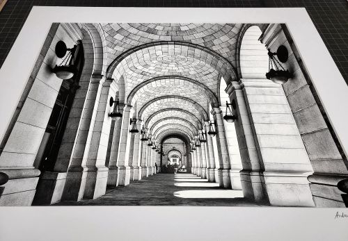 A matted black and white architectural fine art print of 'Union Station Arcade' by photographer Andrew Prokos