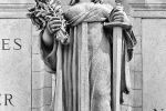 Black and white fine art photograph of the statue of the goddess Themis from the facade of Union Station in Washington DC