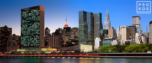An ultra-high-resolution panoramic skyline photo of Midtown East, the United Nations and Chrysler Building transitioning from day to night, from Andrew's 'Night & Day' series.