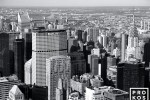 A black and white cityscape photo of the skyscrapers of Midtown Manhattan from the Empire State Building, New York City