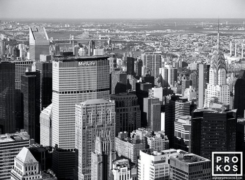 A black and white cityscape photo of the skyscrapers of Midtown Manhattan from the Empire State Building, New York City