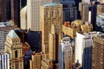 A color cityscape photo of the skyscrapers of Midtown Manhattan as seen from the top of the Empire State Building in New York City