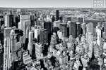 A black and white aerial view of the skyscrapers of Midtown Manhattan, New York City