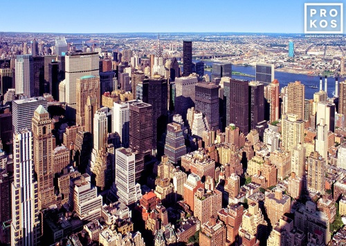 A cityscape of the skyscrapers of Midtown Manhattan, New York City as seen from the Empire State Building. Fine art prints of this photo are available framed in various styles. 
