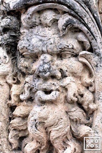 An architectural detail representing Aeolus, God of the Winds carved from local coralstone, at Vizcaya Museum, Miami, Florida