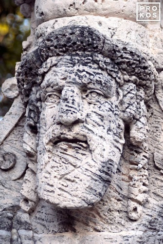 Photo of an allegorical herm made of coralstone in the gardens of Vizcaya Museum, Miami, Florida