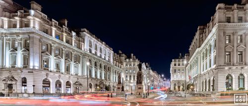 A panoramic view of Waterloo Place and Pall Mall seen at night, London, United Kingdom. Large-scale limited edition prints of this color photo are available up to 120 inches in width.