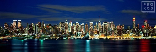 A long-exposure panoramic skyline photo of Midtown Manhattan at night from Weehawken, New Jersey