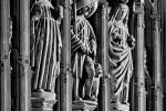 A row of gothic stone statues, including the central statue of Saint Roch, found in the Lady Chapel at Westminster Abbey, London. Limited edition black and white prints of this photograph are available up to 72 inches in height and framed in various wood, metal and acrylic styles.