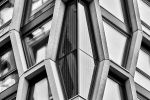 A black and white close-up architectural photo of the geometric facade of The Broadway building in London, England, United Kingdom by photographer Andrew Prokos.