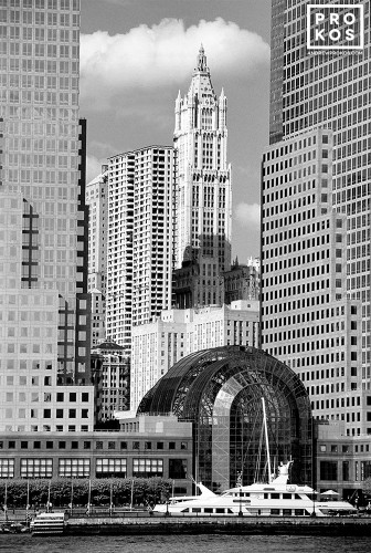 A black and white photo of the World Financial Center and Woolworth Building from the Hudson River, New York City