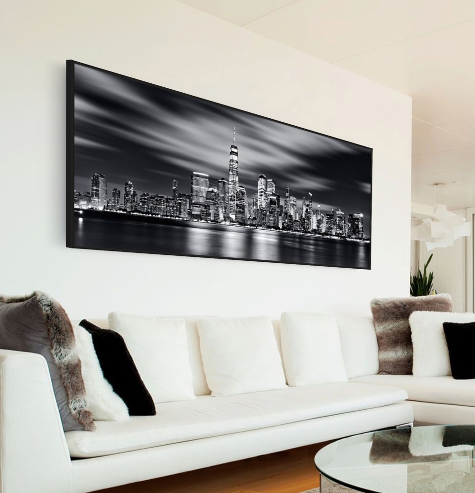 An ethereal framed black and white photo of the World Trade Center and Manhattan NYC skyline at night, captured with a long-exposure time by photographer Andrew Prokos