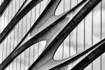 A black and white architectural photo of the facade of the Zaha Hadid Building at 520 West 28th Street, in the West Chelsea / High Line area of Manhattan. Large-scale framed prints of this photo are available up to 80 inches in height.