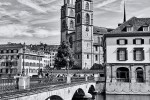 A view of Grossmünster Cathedral and the Münsterbrücke as seen from the Limmat River, Zurich, Switzerland.