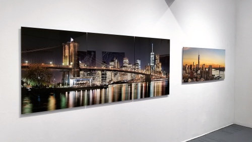 A 96 inch large-format panoramic photograph of the Brooklyn Bridge at Night on display at Andrew Prokos Gallery in Tribeca, New York City