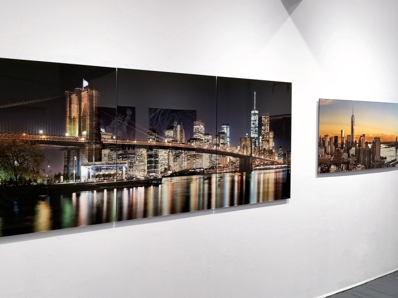 A 96 inch large-format panoramic photograph of the Brooklyn Bridge at Night on display at Andrew Prokos Gallery in Tribeca, New York City