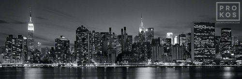 A black and white panoramic skyline photograph of Midtown Manhattan at Night