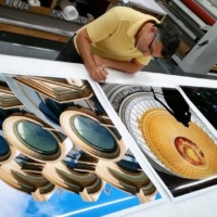 Photographer Andrew Prokos signing large scale fine art prints of Washington DC for Hyatt Hotels.