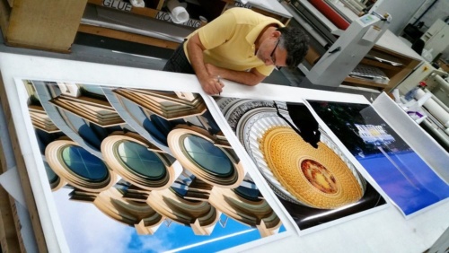 Photographer Andrew Prokos signing large scale fine art prints of Washington DC for Hyatt Hotels.